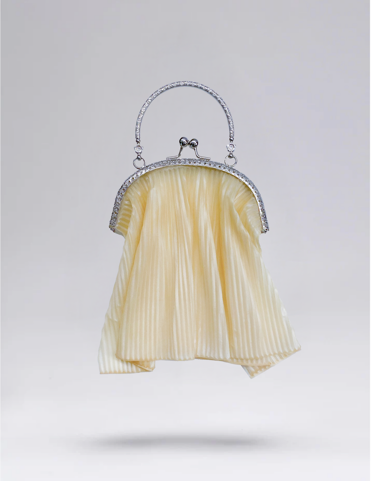 SS26 METAL CLUTCH LATEX BAG